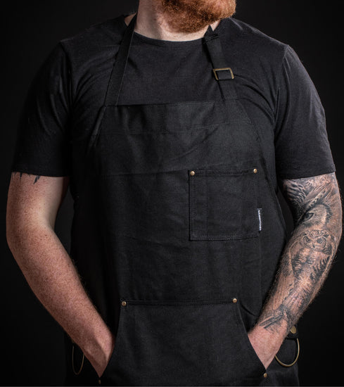 Heavy-Duty schwarze Canvas-Küchenschürze mit Telefon-/Stiftfach, abnehmbaren Küchentuchringen und Sweatshirt-Stil Tasche